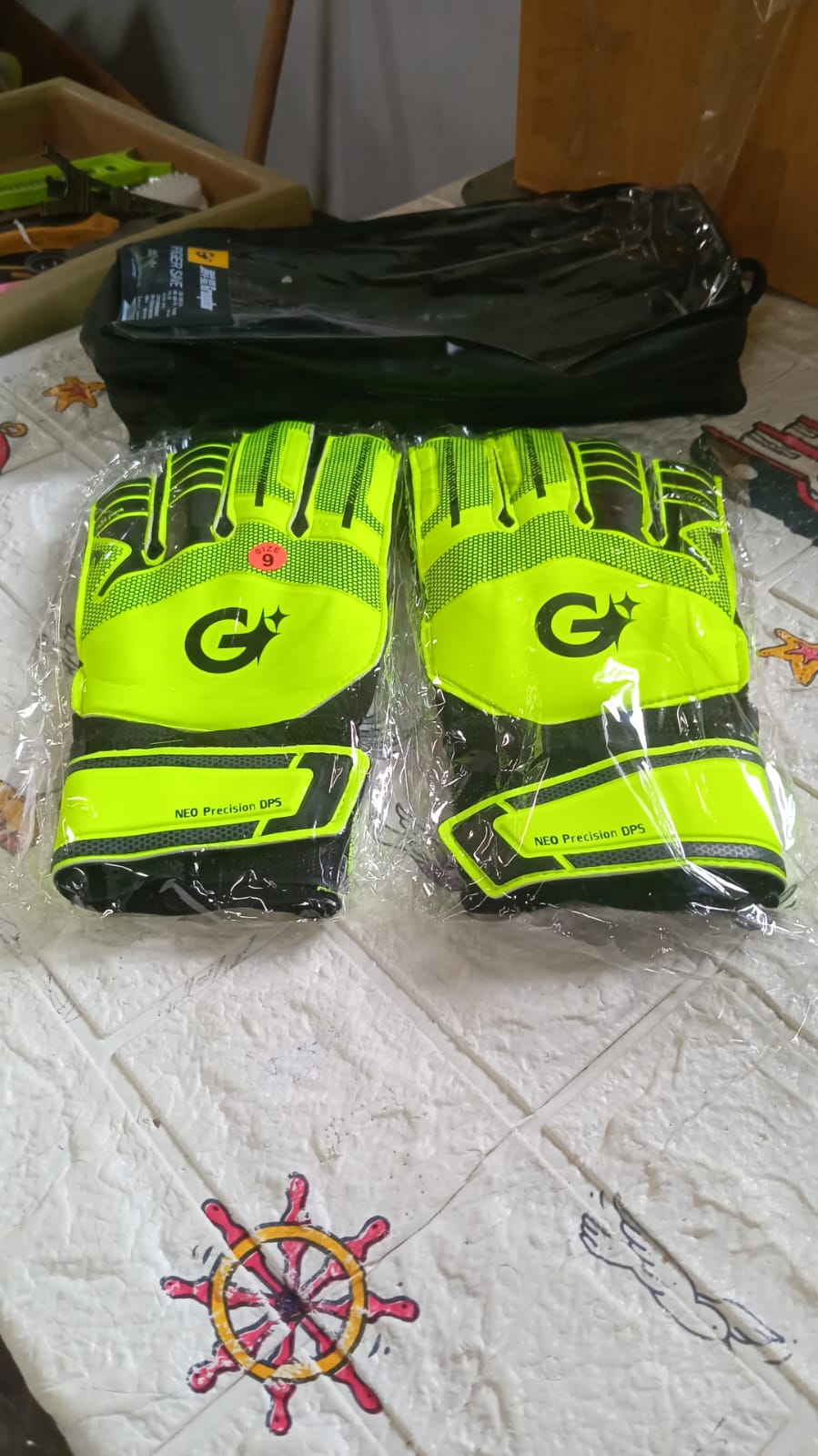 Football gloves showing super grip palm and protective features