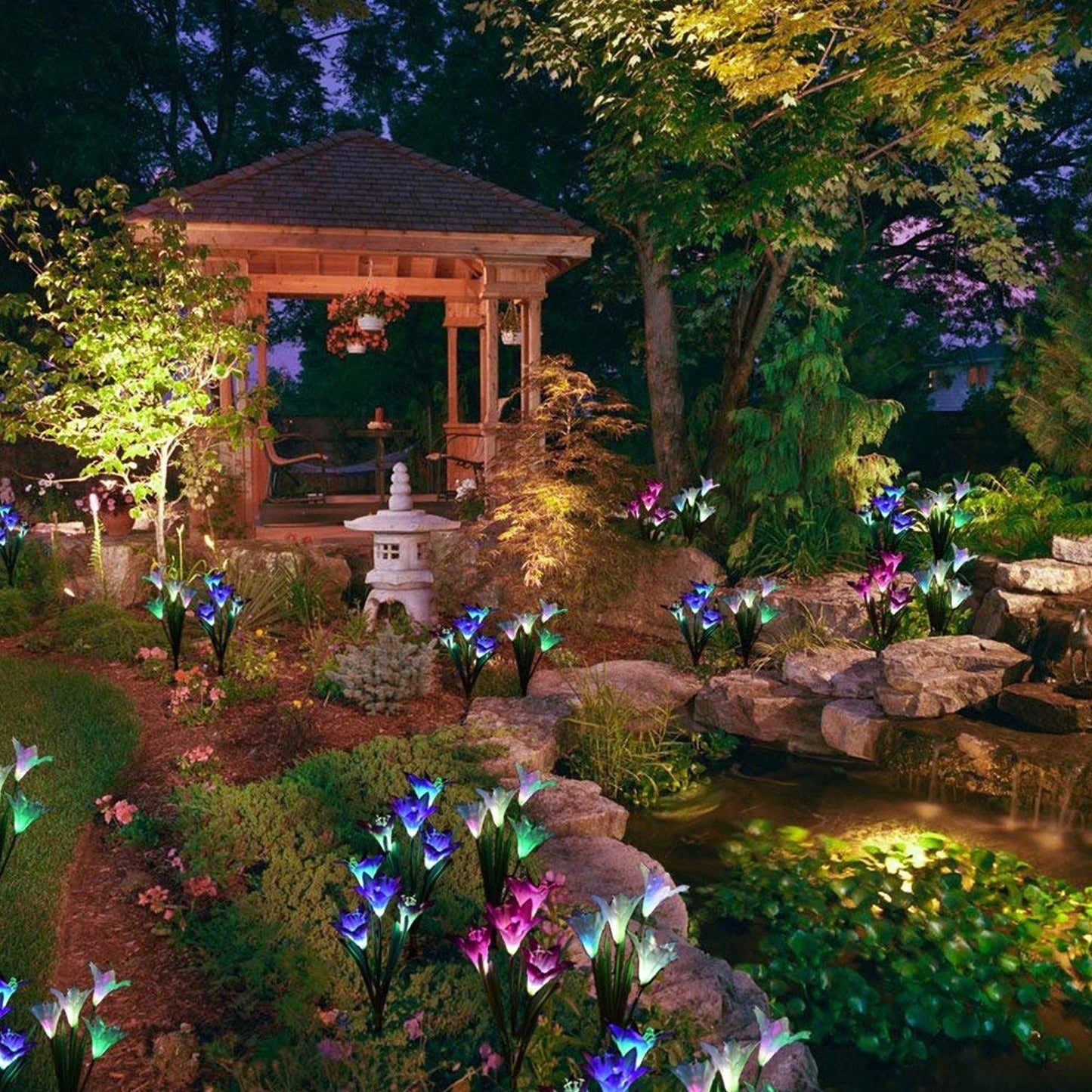 Solar lily lights, outdoor stake, glowing brightly