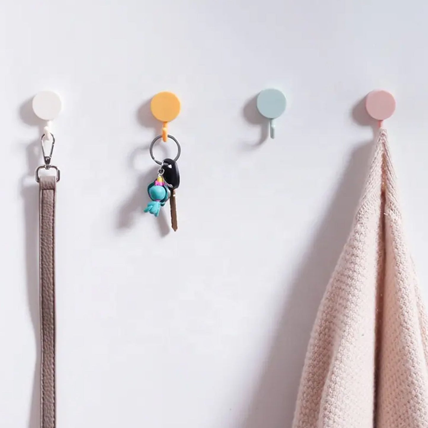 Wall hooks with adhesive backing