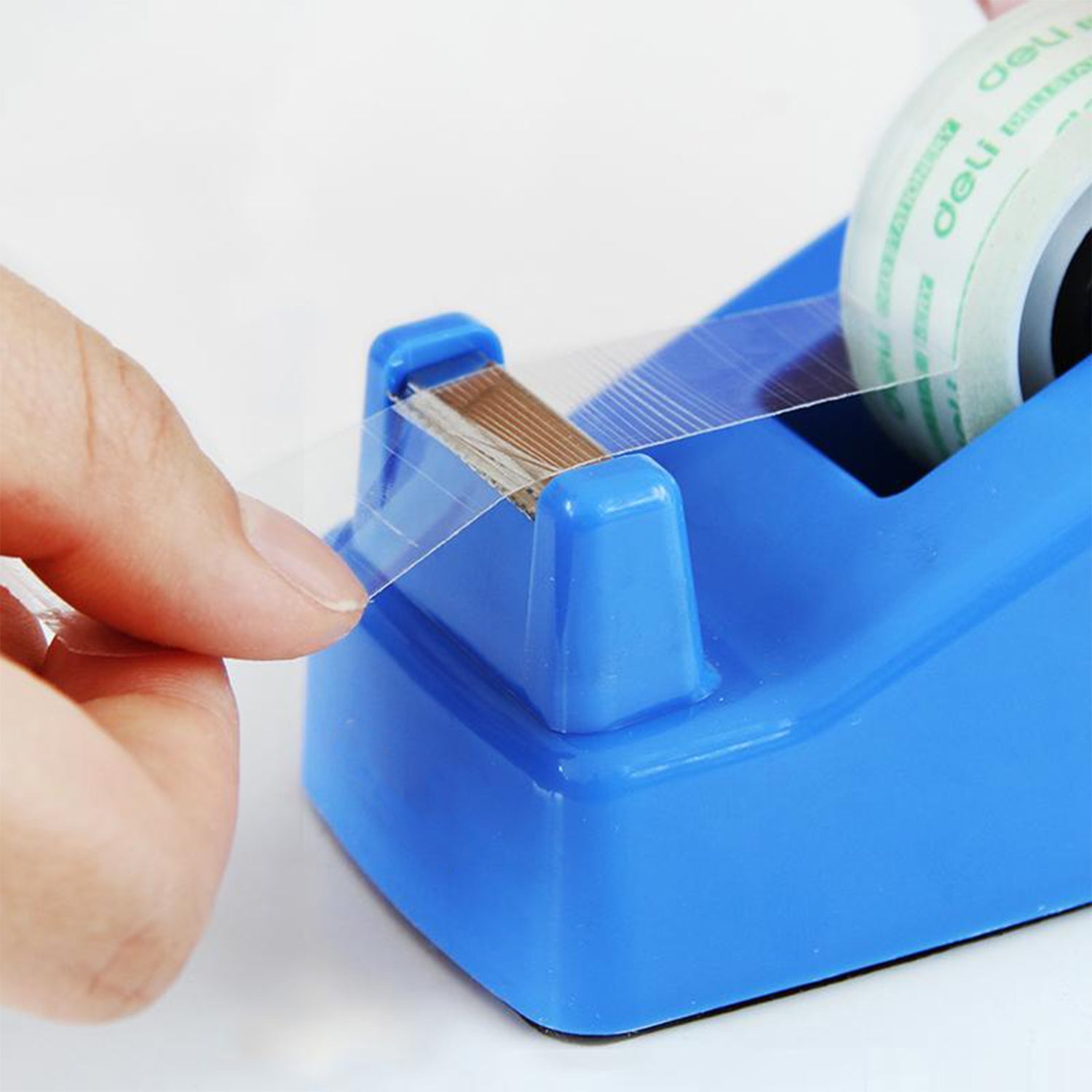 Mini tape dispenser with cutting blade for convenience.