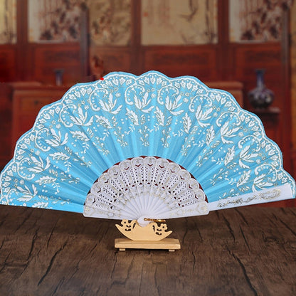 Chinese-style folding fan with floral designs, ideal for cooling and decorative purposes. Comes with a fabric sleeve.