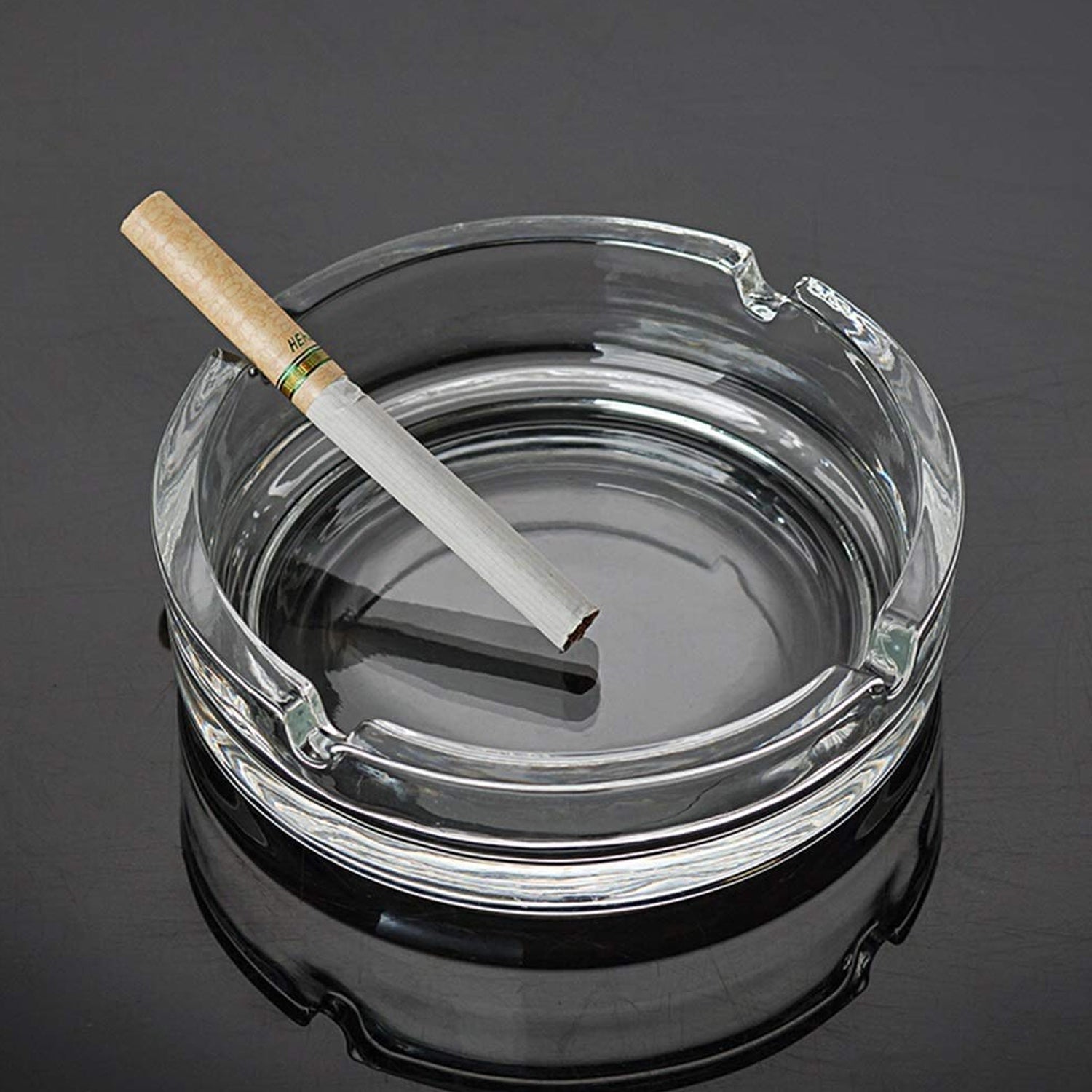 Durable crystal ashtray with a sleek design.