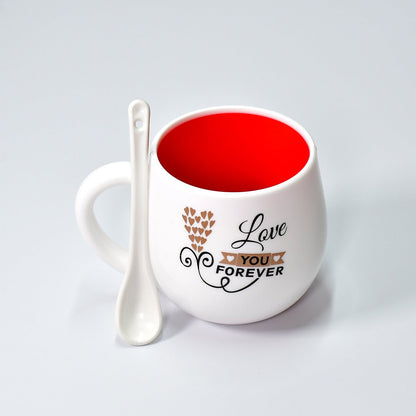 Ceramic coffee mug with matching spoon, perfect for gifting