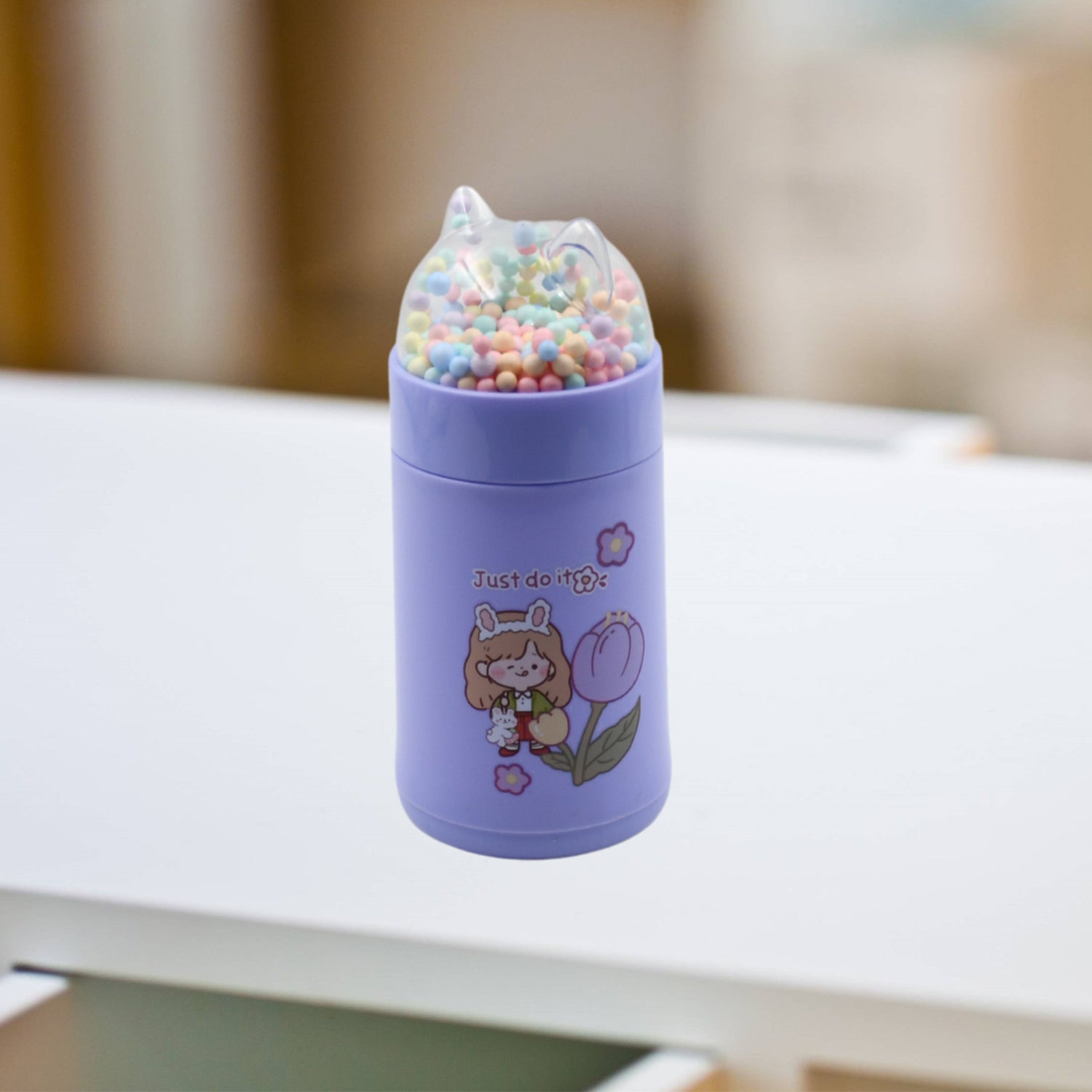 Kid-friendly water bottle with sparkle strap.