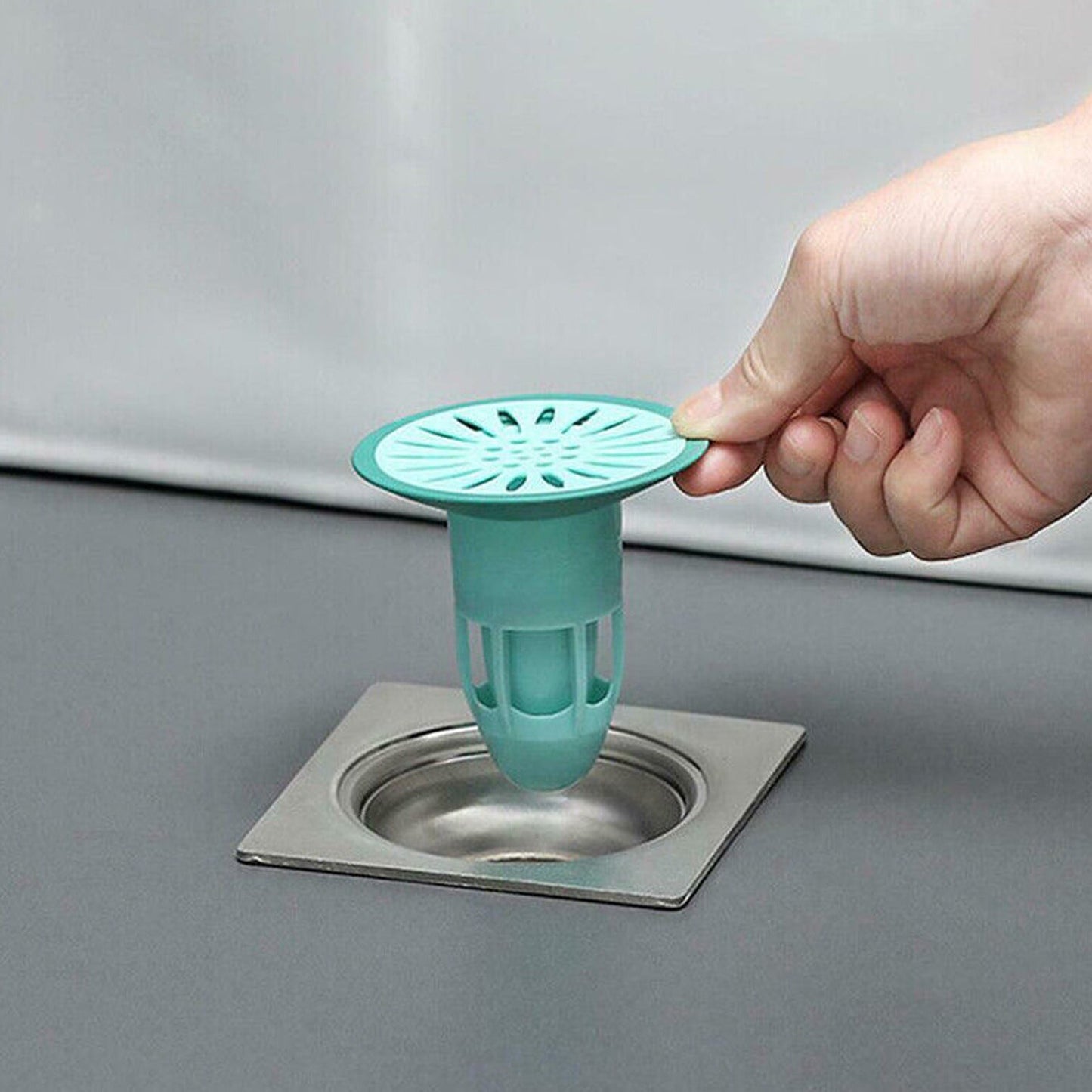 Anti-odor and insect-proof silicone drain stopper, traps hair and debris for kitchen and bathroom.