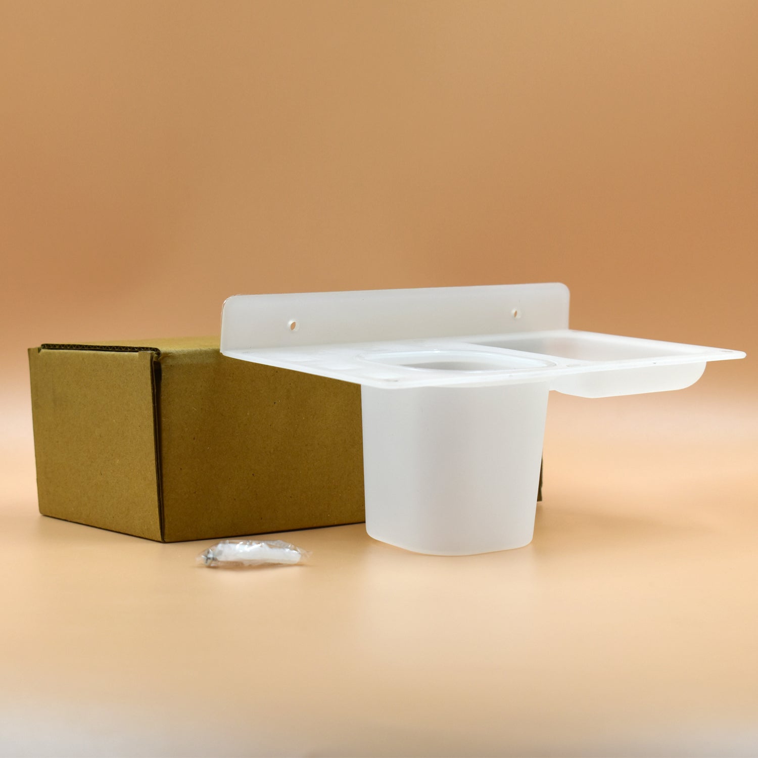 Three-in-one plastic soap dish with tray for use in bathrooms and kitchens.