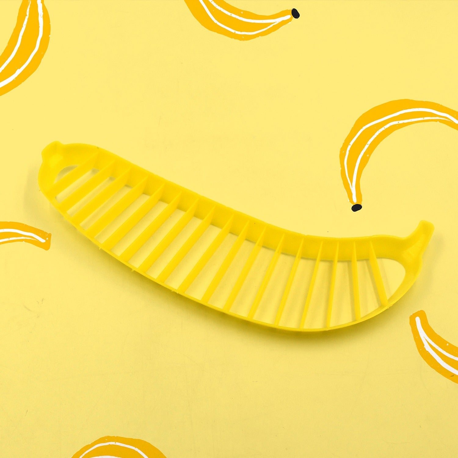 Plastic banana slicer, handle design, chopper for fruit salad preparation.