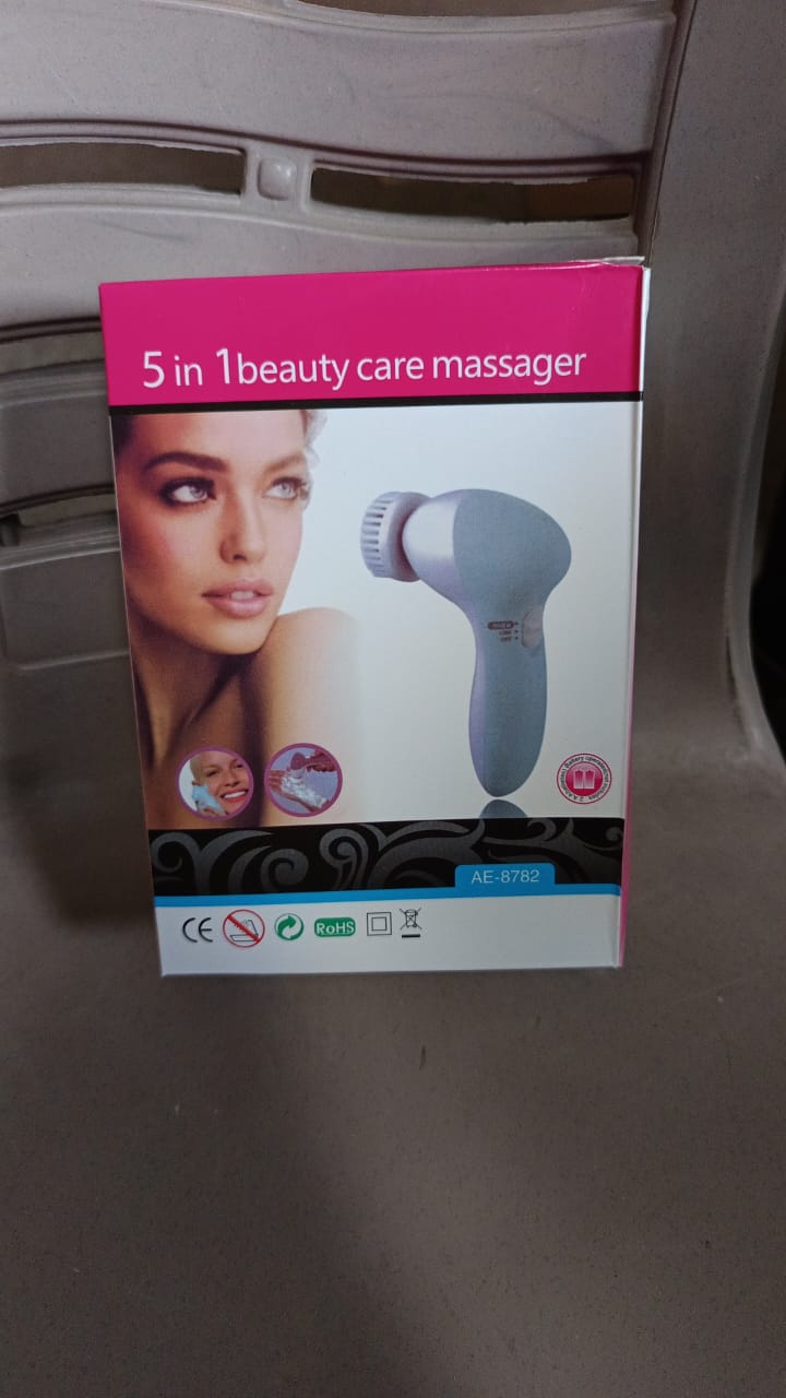 Pink 5-in-1 facial and body massager.