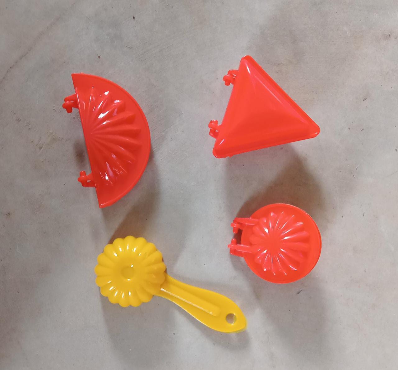 Four-piece set of red plastic kitchen dough press molds